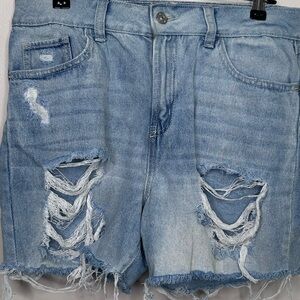 Super High Rise Light Blue Jean Shorts ripped in the front